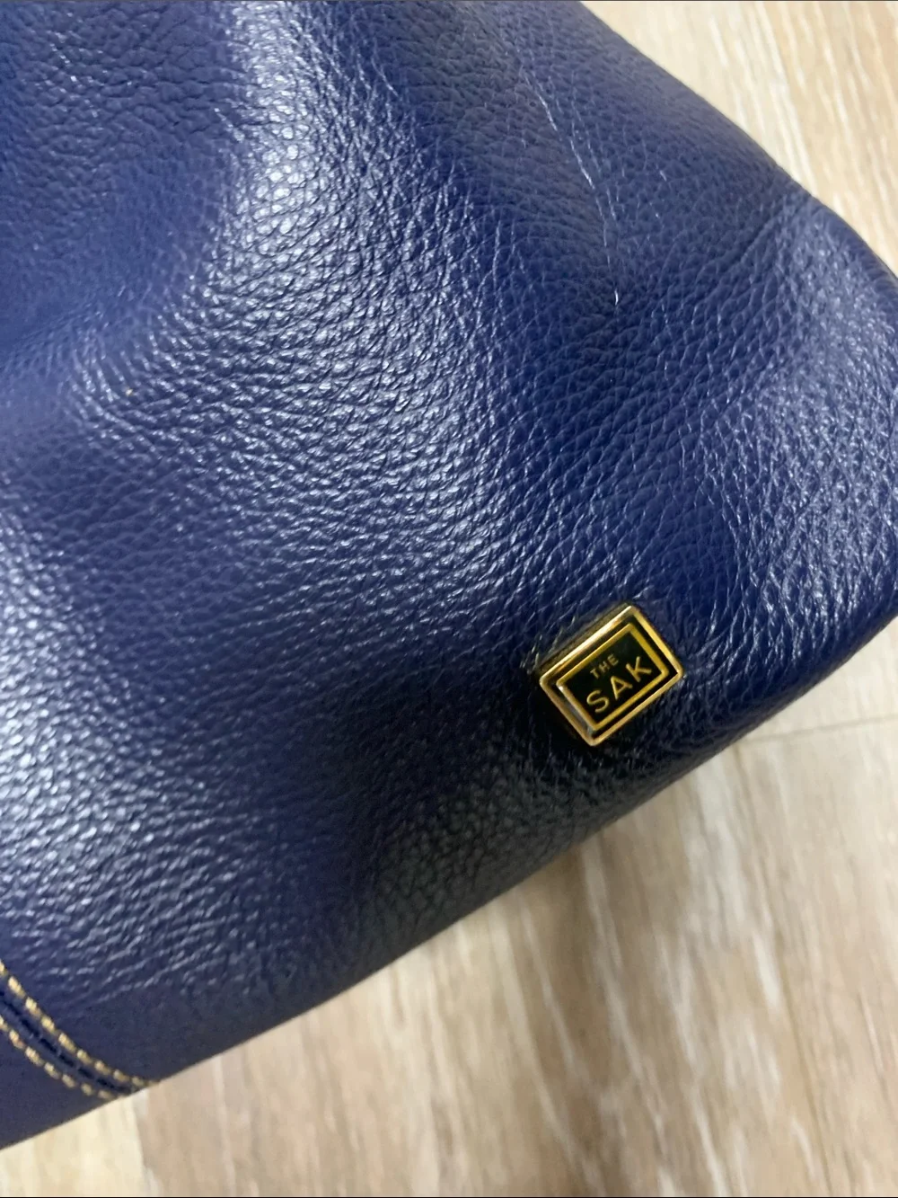 The Sak Navy Leather Shoulder Bag with Red Lining